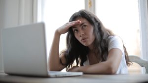 What the Heck Is Bitcoin, Anyway? Confused woman at laptop computer